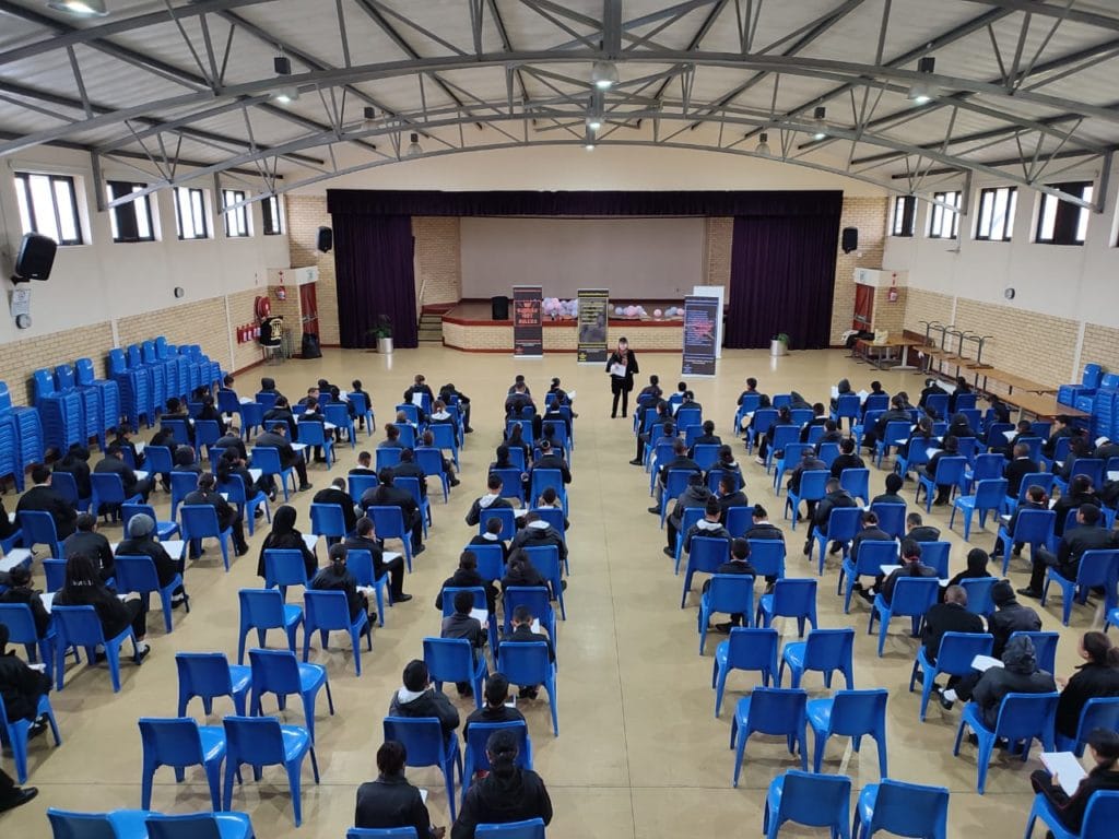 Dr Brenda Matthews conducting a school bullying survey in one of the Garden Cities Archway Foundation halls. All the young respondents were sourced from Western Cape Schools where halls have been provided by the Foundation in collaboration with the WCED. The Foundation reached its 100th milestone hall at the time of Garden Cities' Centenary. More than 108 have been built so far.